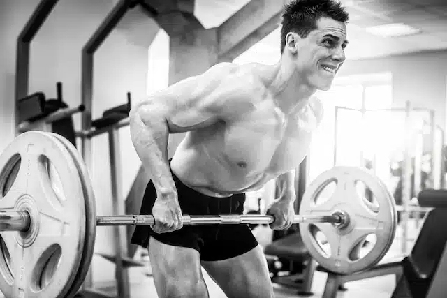 man performing a barbell row